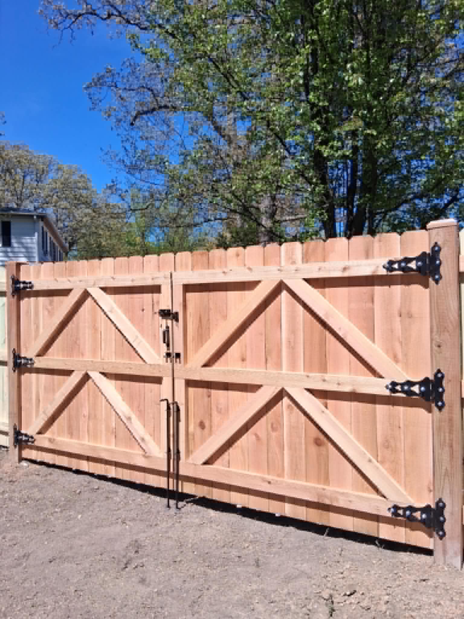 Custom wooden double driveway gate with black hardware